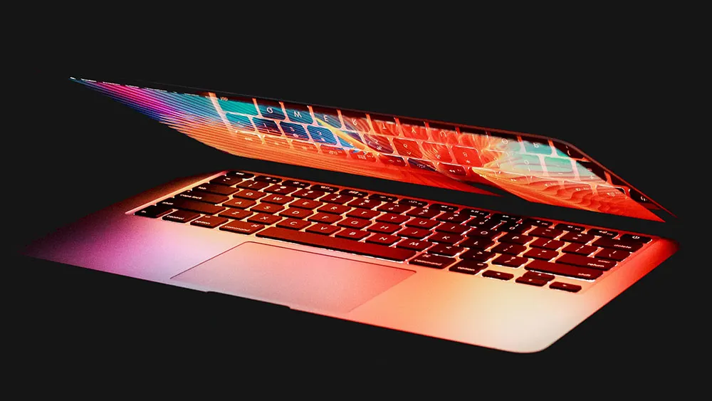 macbook in front of a dark background
